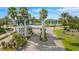 Community gated entrance with palm trees and landscaping at 933 Riverscape St, Bradenton, FL 34208