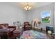 Home office with leather chairs and colorful rug at 933 Riverscape St, Bradenton, FL 34208