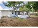 Backyard with screened porch, shed, and patio furniture at 1419 30Th N Ave, St Petersburg, FL 33704