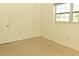 Simple bedroom with carpet and window at 5163 Tangelo Dr, New Port Richey, FL 34652