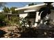 White house exterior with awning and shrubs at 5163 Tangelo Dr, New Port Richey, FL 34652