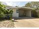 House exterior showcasing a carport and well-maintained landscaping at 5163 Tangelo Dr, New Port Richey, FL 34652