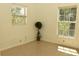 Bright bedroom with wood-look flooring and large windows at 5163 Tangelo Dr, New Port Richey, FL 34652