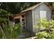 Metal storage shed and adjacent chicken coop at 5163 Tangelo Dr, New Port Richey, FL 34652