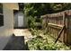 Backyard with shed, fence, and small paved area at 5163 Tangelo Dr, New Port Richey, FL 34652