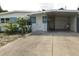 House exterior showcasing a carport and well-maintained landscaping at 5163 Tangelo Dr, New Port Richey, FL 34652