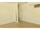 Bright living room featuring built-in shelving and speckled flooring at 5163 Tangelo Dr, New Port Richey, FL 34652