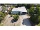Aerial view of a single-Gathering home with a driveway and yard at 5163 Tangelo Dr, New Port Richey, FL 34652