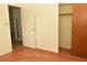 Bedroom with wood flooring and a closet at 5163 Tangelo Dr, New Port Richey, FL 34652