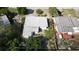 Aerial view of a house and surrounding landscape, including trees and yard at 5163 Tangelo Dr, New Port Richey, FL 34652