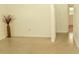 Simple living room with light walls and speckled flooring at 5163 Tangelo Dr, New Port Richey, FL 34652