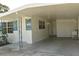 Covered carport with access to the house entrance at 5163 Tangelo Dr, New Port Richey, FL 34652