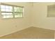 Bright bedroom with carpet and window at 5163 Tangelo Dr, New Port Richey, FL 34652