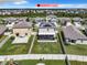 Aerial view of house, backyard, and surrounding neighborhood at 9641 Channing Hill Dr, Ruskin, FL 33573