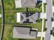 Aerial view showcasing house with solar panels and neighborhood at 9641 Channing Hill Dr, Ruskin, FL 33573