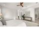 Bright bedroom with wooden ceiling fan, light wood floors, white walls, and modern decor at 1625 55Th S St, Gulfport, FL 33707