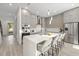 A modern eat-in kitchen with gray cabinets, stainless steel appliances and quartz countertops at 1625 55Th S St, Gulfport, FL 33707