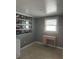 Bedroom features a desk, large window, and gallery wall at 8112 Alpine Ave, Tampa, FL 33619