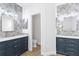 Elegant bathroom boasts double vanities, herringbone tile, and modern fixtures at 10616 Cape Hatteras Dr, Tampa, FL 33615