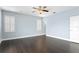 Spacious bedroom with hardwood floors and light blue walls at 10616 Cape Hatteras Dr, Tampa, FL 33615