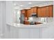 Spacious kitchen island with white quartz countertops at 10616 Cape Hatteras Dr, Tampa, FL 33615