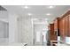 Modern kitchen with wood cabinets and stainless steel appliances at 10616 Cape Hatteras Dr, Tampa, FL 33615