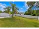 Spacious backyard with fire pit and view of neighboring homes at 10616 Cape Hatteras Dr, Tampa, FL 33615