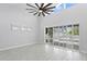 Living area with sliding doors leading to a pool and patio at 10616 Cape Hatteras Dr, Tampa, FL 33615