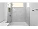 Clean bathroom with a bathtub and shower, featuring modern fixtures at 10616 Cape Hatteras Dr, Tampa, FL 33615