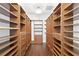 Large walk-in closet with ample shelving and drawers at 10616 Cape Hatteras Dr, Tampa, FL 33615