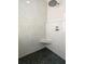 Spa-like shower with pebble floor and built-in bench at 10616 Cape Hatteras Dr, Tampa, FL 33615