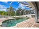 Refreshing pool and spa with screened enclosure and backyard access at 10616 Cape Hatteras Dr, Tampa, FL 33615