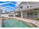 Relaxing pool and spa area with covered patio and lush landscaping at 10616 Cape Hatteras Dr, Tampa, FL 33615
