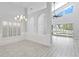 Open concept dining room with hardwood floors and access to backyard at 10616 Cape Hatteras Dr, Tampa, FL 33615