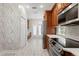 Kitchen features white quartz countertops and wood cabinets at 10616 Cape Hatteras Dr, Tampa, FL 33615