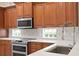 Kitchen features stainless steel appliances and wood cabinets at 10616 Cape Hatteras Dr, Tampa, FL 33615