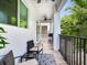 Relaxing back patio with seating area and grill, perfect for outdoor entertaining at 156 175Th E Ave, Redington Shores, FL 33708