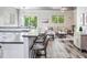 Open concept kitchen with island and living room views at 156 175Th E Ave, Redington Shores, FL 33708