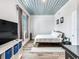 Spacious bedroom with a king-size bed and an industrial-style ceiling at 156 175Th E Ave, Redington Shores, FL 33708