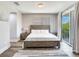 King bed, wood floors, and access to private balcony at 156 175Th E Ave, Redington Shores, FL 33708