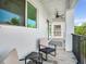 Relaxing balcony with seating area, offering views and a peaceful outdoor space at 156 175Th E Ave, Redington Shores, FL 33708