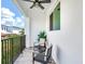 Private balcony with patio furniture and neighborhood views at 156 175Th E Ave, Redington Shores, FL 33708