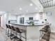 Sleek kitchen boasting a large island with seating and modern cabinetry at 156 175Th E Ave, Redington Shores, FL 33708