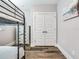 Bedroom featuring a bunk bed and double doors to closet at 156 175Th E Ave, Redington Shores, FL 33708