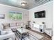 Open living area featuring a sectional sofa and modern decor at 156 175Th E Ave, Redington Shores, FL 33708