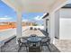 Rooftop patio with a table and chairs, offering stunning views at 156 175Th E Ave, Redington Shores, FL 33708