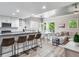 Open concept kitchen and living room with modern finishes and ample natural light at 156 175Th E Ave, Redington Shores, FL 33708