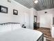 King-size bed, ensuite bathroom, and ample closet space at 156 175Th E Ave, Redington Shores, FL 33708