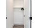 Walk-in closet with wood shelving and hanging rods at 160 174Th Terrace E Dr # A, Redington Shores, FL 33708