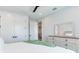Bedroom with a mirror, dresser and a view of the hallway at 160 174Th Terrace E Dr # A, Redington Shores, FL 33708